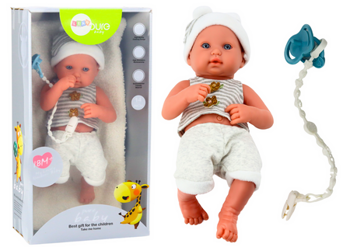 Baby doll in white and gray clothes, hat, pacifier, and blanket